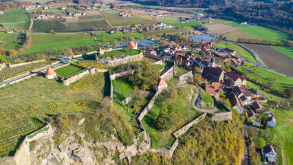 Aerial view of the Riegersburg castle with vineyards on a beautiful autumn day