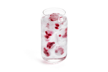 Glass of sparkling water with ice with pomegranate seeds on a white background for Valentine's day