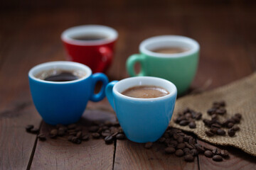 Black coffee in colorful cups. Fresh coffee for a break.