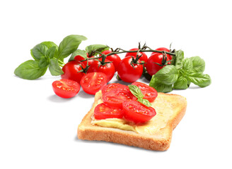 Fototapeta na wymiar Delicious toast with butter, tomatoes and basil isolated on white