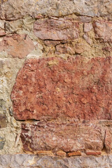 Grungy stone wall of an abandoned building