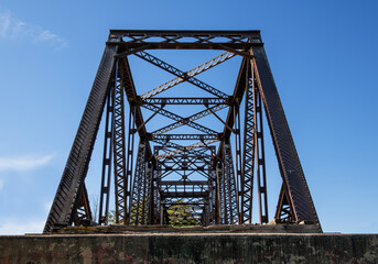 Old rusted girders of a railway bridge