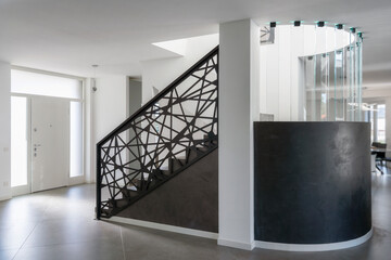 modern resin staircase inside luxury house, glass and iron elements complete the design - 543927572
