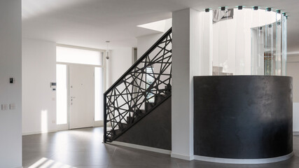 modern resin staircase inside luxury house, glass and iron elements complete the design