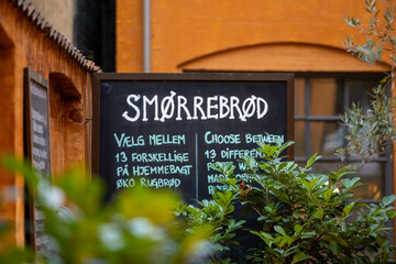 Fototapeta na wymiar Copenhagen, Denmark A sign in Danish advertising the traditional smorrerbrod food.