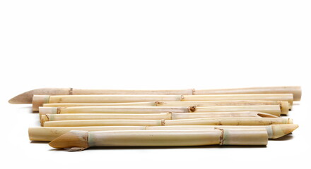 Yellow bamboo sticks isolated on white, side view