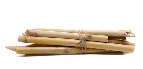 Yellow group bamboo sticks isolated on white, side view