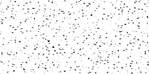 Small uneven spots and particles of debris. Abstract vector texture. Distressed uneven background. Grunge texture overlay with fine grains isolated on white background. Vector illustration. EPS10.