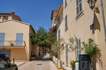 Fototapeta na wymiar Saint Tropez, France - August 8, 2022 - the narrow streets and squares of the world-famous French town on a summer afternoon
