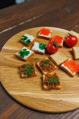 Meat spread on toasted bread with greens. Fresh, delicious croutons made from whole grain bread
