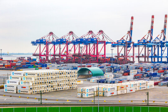 Industrial area cranes container dyke seascape panorama in Bremerhaven Germany.