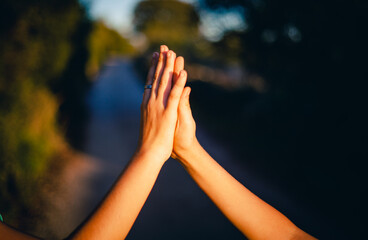child hands approaching to five five