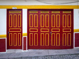 Red and Yellow Doors in a White Background, Characteristic of the Town of Jerico, Antioquia, Colombia