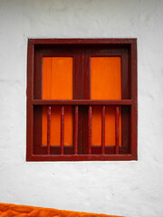 Brow and Orange Window Forming a Cross in a White Background, Characteristic of the Town of Jerico, Antioquia, Colombia