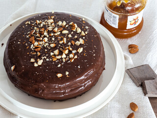 Sacher Torte, a chocolate cake originating from Austria, it has layers filled with apricot jam and covered in chocolate ganache