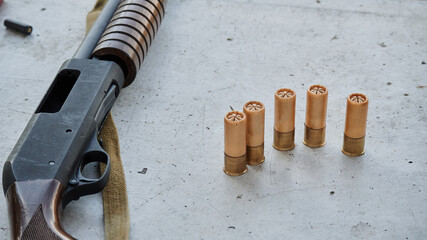 pump action shotgun 12 gauge with bullets from it