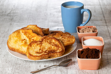 (Torrijas) Fried bread soaked in milk flavored with vanilla, cinnamon and lemon, and egg. Typical Easter sweet. Traditional and festive cuisine concept.