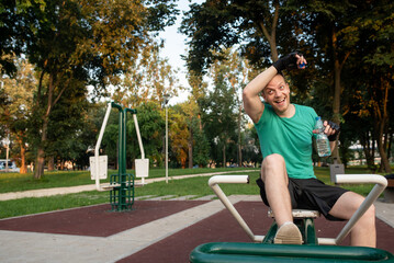 Refreshment during a training in outdoor gym