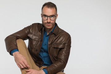Fototapeta premium attractive casual man is looking at the camera