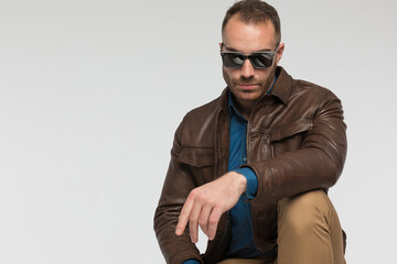 Fototapeta premium sexy casual man is posing with tough attitude