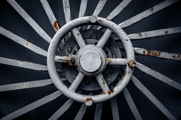 Old, abandoned shelter hatch door wheel