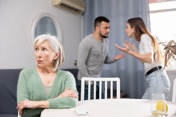 Offended elderly mother dont speaking with adult children during home quarrel