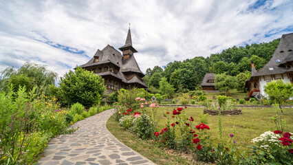 Fototapeta na wymiar A spiritual retreat: The peaceful ambiance of Romania's wooden churches.