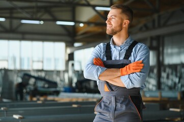 Profesional fabric worker. Metal processing plant. A worker at a metal profile warehouse.