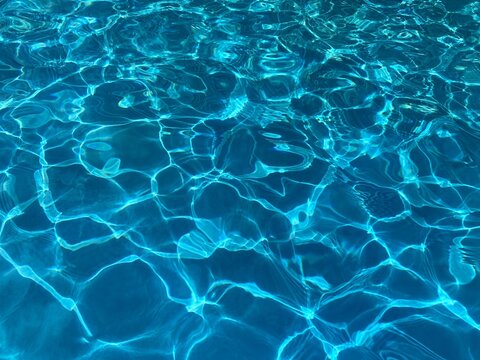 Blue water pool shiny clear background.