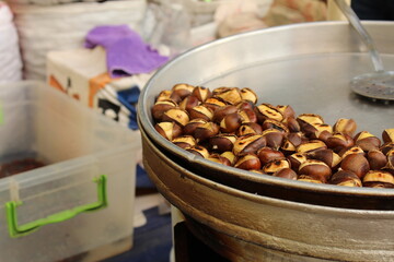 Fresh roasted chestnut on a roasting stall