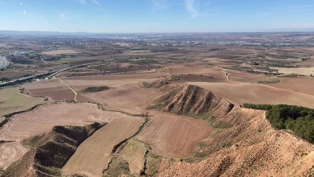 henares corridor with Madrid in the background and the NII highway as it passes through Guadalajara from the top of the Aguila peak, fields of crops, Guadalajara, Spain, 4k