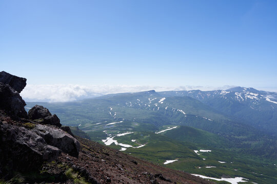 Beautiful mountains and blue sky seen from the trail to Mt. Asahidake