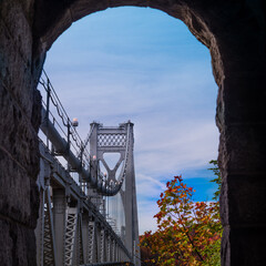 An Autumn view of the mid-Hudson bridge in New York state in through an arch  
