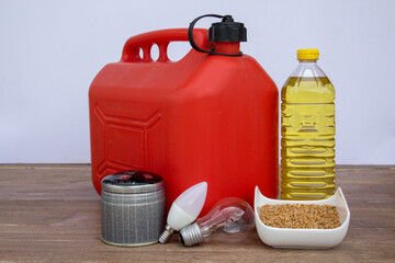 Image of a petrol can, light bulbs, a can of gas, bottle of seed and wheat oil. Reference to the...