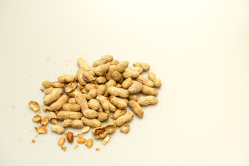 A top-down studio shot of healthy organic peanuts isolated against a white background.  