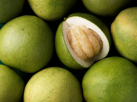 Ripe pomelo fruit, citrus fruits background.