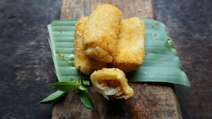 Selective focus risoles sosis mayo or mayonnaise sausage rissole is a small patty rolled in...