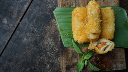 Selective focus risoles sosis mayo or mayonnaise sausage rissole is a small patty rolled in...