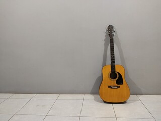 Fototapeta na wymiar acoustic guitar on gray background