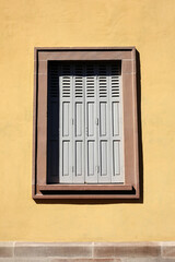 Vintage Wooden Window on Stucco Wall Background in Minimal Style.