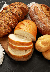 Bread assortment on dark background.