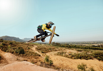 Mountain bike, man and air jump, action and bicycle cycling, challenge and adventure, freedom and...