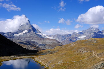 Matterhorn Reflected on Riffelsee with Covered White Cloud.