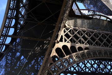 Light Beam on Gigantic Curve of Eiffel Tower.