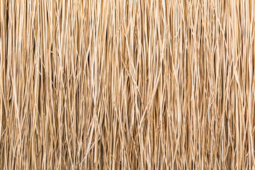Close up of thatch roof or wall background. Tropical roofing on beach - obrazy, fototapety, plakaty