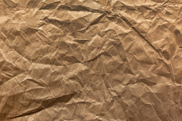 The texture of crumpled brown wrapping paper. Abstract paper background and pattern