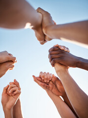 Low angle, group and holding hands in support, trust huddle and motivation for global success,...