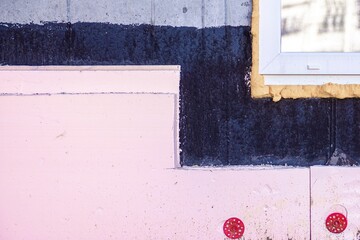 window opening in a monolithic wall covered with waterproofing impregnation with insulation with...