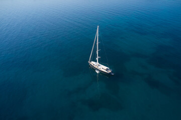 Sailing sports yacht on the water aerial view. A large expensive high-speed sailing yacht is...