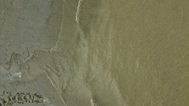 Waves rolling on empty Ganges banks. West Bengal. India. Aerial looking down.